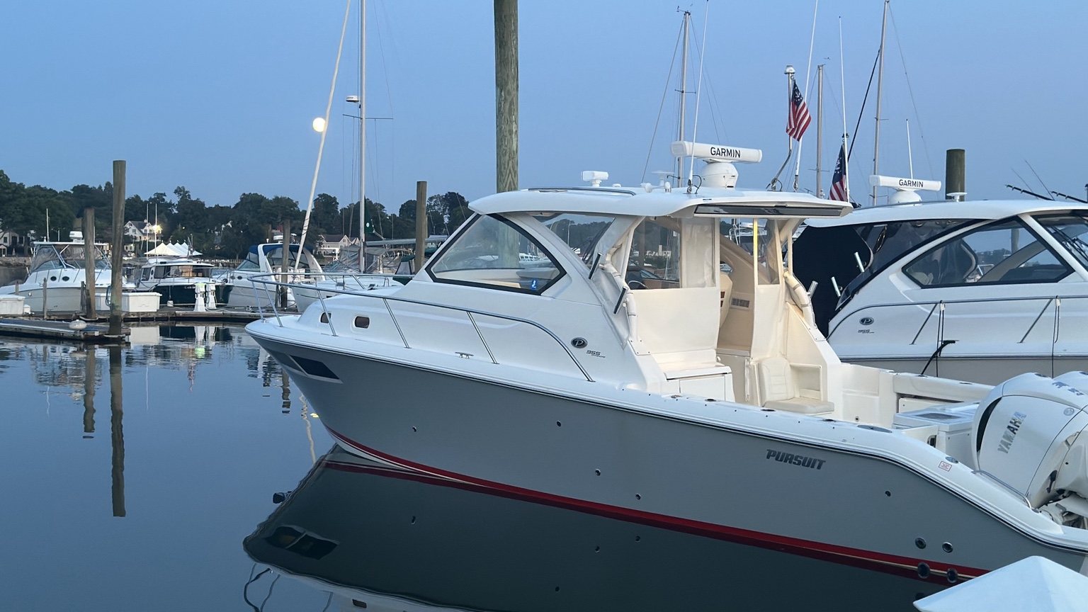 Grey Expectations, a grey Pursuit OS 355 with triple Yamaha outboards